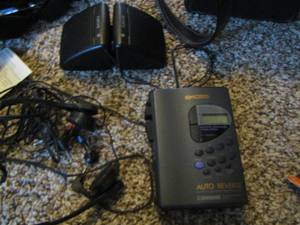 lot 845 image: Koss walkman with head phones- mini speakers - brown carry bag