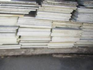 lot 704 image: Large qty of concrete board- some 12ft some cut shorter- minor damage to a few pieces from weather