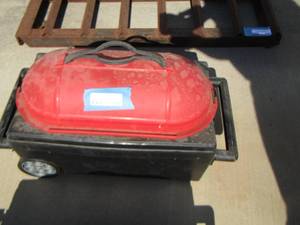 lot 908 image: Bowling ball case on wheels with 2 bowling balls inside