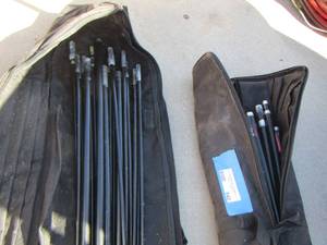 lot 940 image: 2 black bags of tent poles
