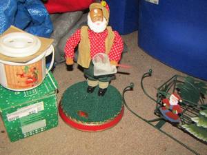 lot 950 image: Santa gone fishing- metal Santa sleigh - potpourri burner