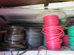 lot 1056 image: various rolls of wire green - red- yellow