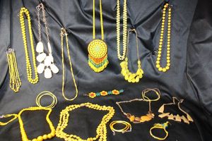 lot 220 image: (15) Selection of YELLOW and complementary color jewelry. Assorted styles, ages, and materials. Separately bagged.