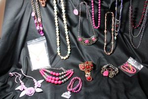 lot 212 image: (15) Selection of PINK color jewelry. Assorted styles, ages, and materials. Separately bagged.