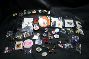 lot 244 image: (50) Lapel Pin selection. Includes Enamel Hendricks Gin, United Airlines, Mr. Electric, and more
