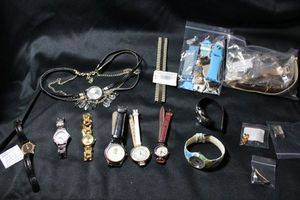 lot 247 image: Watches and watch strapparts. Includes Timex, Denver Public Schools, Armitron WR-165, Swiss Armitron with diamond marker, straps, watch pieces. Also includes an unused Caravelle flex band $100 retail tag