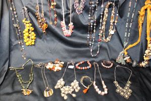 lot 239 image: (20) Selection of Brown and Autumnal color jewelry. Assorted styles, ages, and materials. Separately bagged.