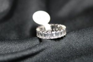 lot 25 image: Sterling Silver baguette CZ ring. Marked 925 CH GM inside. Ring tag attached. Size 7