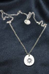 lot 8 image: Signed Lisa Leonard Sterling Silver SUNBURST CZ pendant 18L round link necklace. Marked 925 on lobster clasp. Has Lisa Leonard jewelry hang tag. 7.2 gr approx