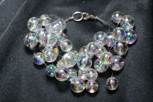 lot 5 image: Artisan crafted aurora borealis glass bead station 5-strand 7L bracelet with sterling lobster clasp. Marked 925 on clasp.