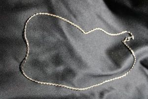 lot 9 image: Signed Avon Sterling Silver elongated flat link diamond cut 19L necklace. Marked Sterling on both spring ring and connector and Avon. 7.5 gr approx