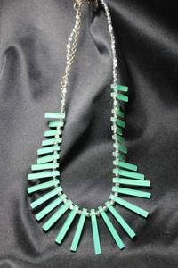 lot 22 image: Sterling Silver green translucent acrylic spindle and faceted bead wire necklace. Marked 925 on lobster clasp. 16L with 3 extender.