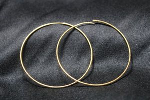 lot 17 image: Sterling Silver vermeil (gold over sterling) hoop earrings. Marked sterling on top of each earring. 2.25W
