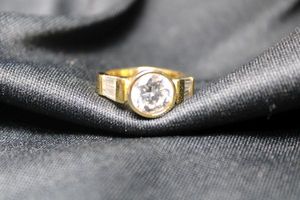 lot 11 image: Sterling Silver vermeil (gold over sterling) bezel set CZ ring with baguette CZ shoulders. Marked 925 inside. Size 5, 6.0 gr approx