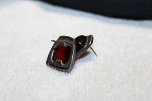 lot 38 image: Sterling Silver and Baltic Amber Vintage poststud earrings, .75L approx. Marked 925 on each earring. Needs cleaned.
