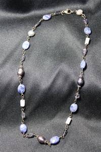 lot 46 image: Signed Silpada Sterling Silver RETIRED Sodalite, Blue Lace Chalcedony and faceted peacock pearl station bead necklace. 14L. Marked 925 on lobster clasp and on Silpada hallmark metal hangtag.