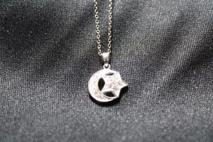 lot 44 image: Sterling Silver Italian moon and star pendant necklace. 18L. Marked 925 Italy on both necklace and pendant. 1.9 gr approx.