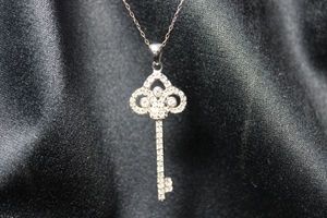 lot 50 image: Sterling Silver crystal pendant in key form on 20L Italian necklace. Marked 925 on pendant, bale and spring ring. Pendant 2L. Marked 925 Italy on clasp. 6.0 gr approx
