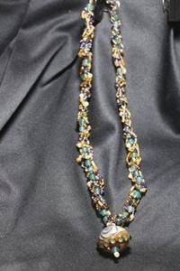 lot 32 image: Sterling Silver and fancy bead necklace with Venetian or Czech oversized hand blown bead pendant.