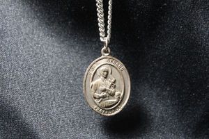 lot 43 image: Sterling Silver Saint Gerard Pray For Us medallion pendant on 24L chain. Pendant marked Sterling Bliss. Chain unmarked but non metallic. 15.6 gr approx