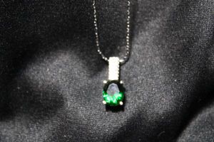 lot 54 image: Sterling Silver elongated cable twist link necklace with green stone pendant. 16L. Both necklace and pendant marked 925. 4.1 gr approx