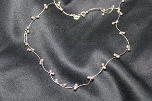 lot 59 image: Sterling Silver Italian fancy curbed bar link with bead ends. 16L necklace. Marked 925 Italy IBB near spring ring clasp. 5.7 gr approx