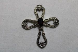 lot 62 image: Signed Gorham Sterling Silver and orange-red Spessartite Garnet cross pendant. 2L. Marked Gorham Sterling on reverse. 8.1 gr approx