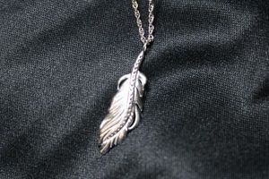 lot 65 image: Sterling Silver rope chain 18L necklace with crystal adorned pendant in leaf form. Pendant 1L. Marked ster 925 on spring ring clasp. 3.7 gr approx