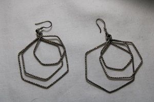 lot 69 image: Sterling Silver graduated and textured heptagon dangle French ear wire earrings. 2.25L. Marked 925 on back of largest heptagon. 5.3 gr approx
