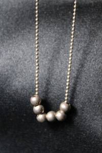 lot 74 image: Sterling Silver vintage ball bead 24L chain with 6 sterling ball beads acting as pendant. Marked 925 on spring ring clasp. 5.3 gr approx