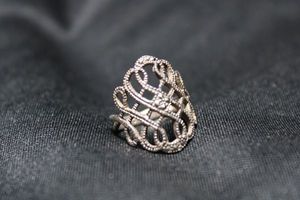 lot 75 image: Sterling Silver marcasite filigree ring. Size 7.25. Marked 925 inside. 3.8 gr approx