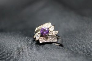 lot 76 image: Sterling Silver and Amethyst glass ring. Size 9. Marked 925 inside. 7.4 gr approx