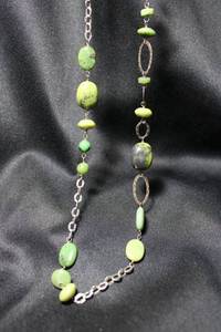 lot 77 image: Sterling Silver and Irish Connemara Marble 32L necklace on fancy link chain with hammered oval links. Marked 925 with hallmark A inside triangle on lobster clasp.