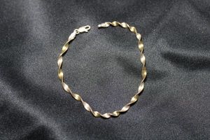 lot 79 image: Sterling Silver Italian two-tone tinsel bracelet. 8L. Marked 925 Italy on lobster clasp. 3.0 gr approx