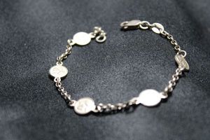 lot 83 image: Sterling Silver Italian bracelet featuring angelic cherub stations. 7.5L. Marked 925 Italy near lobster clasp, 925 on clasp and 925 Italy SA on one of the angel station medallions. 6.4 gr approx