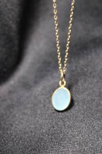 lot 89 image: Sterling Silver vermeil (gold over sterling) flat cable chain 18L necklace with bezel set faceted blue green pendant. Marked 925 near spring ring clasp.