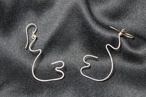 lot 90 image: Sterling Silver figural wire dangle French ear wire earrings. 2L. Marked 925 top of each ear wire.
