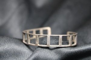 lot 92 image: Sterling Silver Taxco silversmith created geometric cuff bracelet. Marked 925 and M7-3W inside. 13.3 gr approx