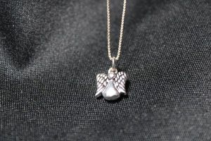 lot 93 image: Sterling Silver Italian 18L box chain necklace with sterling angel pendant. Necklace marked 925 Italy near spring ring clasp and pendant marked 925 on bottom. 3.2 gr approx