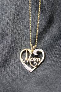 lot 96 image: Sterling Silver vermeil (gold over sterling) cable chain 18L necklace with heart pendant with script MOM. Marked 925 on spring ring clasp and 925 JCM near clasp. Marked 925 JCM on back of 1L pendant. 2.6 gr approx