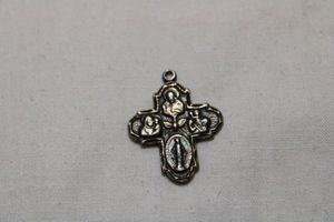 lot 102 image: Sterling Silver I AM A CATHOLIC religious double sided pictorial cross. Marked sterling on back. 4.0 gr approx