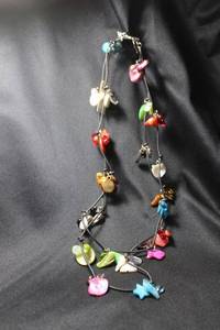 lot 111 image: Freshwater multi color Pearl and Shell extra long corded station necklace. Opera length 56L. Has original material ID tag.