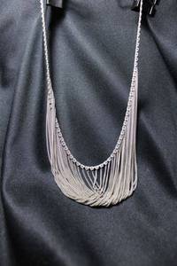 lot 119 image: Sterling Silver silversmith artisan created vintage overlapping bib style necklace. Marked 925 on lobster clasp. Heavy. 27.5 gr approx