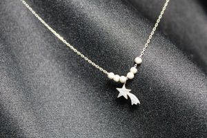lot 122 image: Sterling Silver cable chain necklace with shooting star pendant. Marked 925 Mex near spring ring clasp.18L