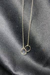 lot 147 image: Sterling Silver cable chain link necklace with incorporated interlocking infinity hoops. Marked sterling on spring ring. 16L