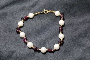 lot 149 image: Signed YR brand cultured pearl and tumbled and polished Garnet chip bead bracelet. YR ID tag. 8L Garnets tested.