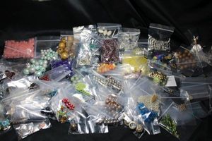 lot 322 image: (75) packages of sorted loose beads. Varying shapes, styles, colors, materials, sizes and quantities.