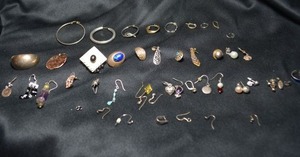 lot 133 image: Sterling Silver scrap. All pieces are marked either 925 or sterling. 79.2 grams approx. Contains broken chains, single earrings, etc.