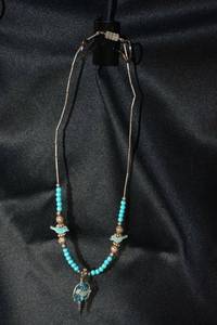 lot 141 image: Sterling Silver silversmith artisan created silver bead, Turquoise bead necklace with Mother of Pearl fetish birds. 15L. Barrell clasp. Dream weaver pendant backing is not sterling.