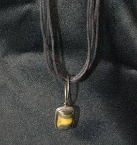 lot 145 image: Corded 5-strand necklace with sterling silver cone ends (marked sterling on both, lobster clasp (marked 925 and sterling banded agate pendant. Large jump ring is not sterling.